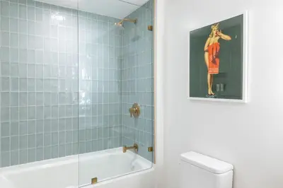 a bathroom with a shower and a tub and a toilet at 2901 Beautiful Downtown Apt with Pool and Gym in Miami