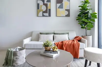 a living room with a couch and a table at 2704 Beautiful Downtown Apt with Gym Pool Spa Skyline Views and in front of Kaseya Center in Miami