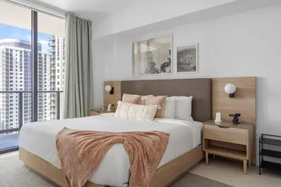a bedroom with a large bed with a large window at 2704 Beautiful Downtown Apt with Gym Pool Spa Skyline Views and in front of Kaseya Center in Miami