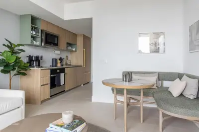a living room with a couch and a table at 3808 Apt Next to Kaseya Center with Pool a Spa and Gym in Miami