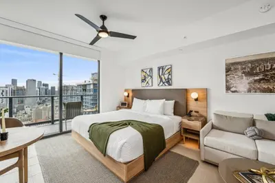 a bedroom with a large bed and a couch at 3312 Modern Apt in front of Kaseya Center with Pool and Gym in Miami