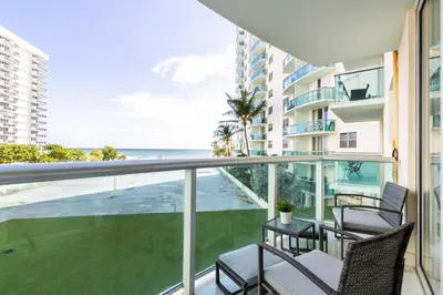 a balcony with chairs and a view of the ocean at Beachfront Winter Escape, Balcony with Ocean View, Amenities in Hollywood
