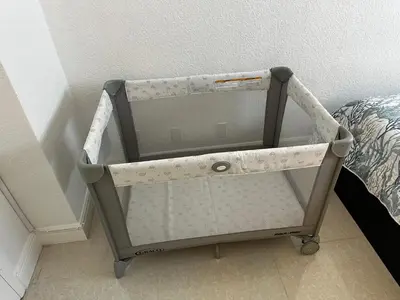 a baby cart is sitting next to a bed at Beachfront Winter Escape, Balcony with Ocean View, Amenities in Hollywood