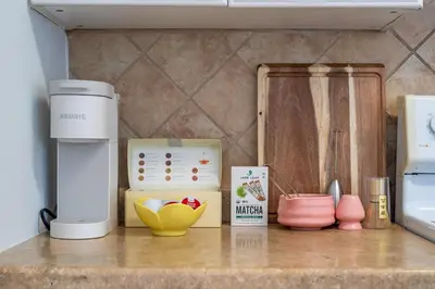 a kitchen counter with various appliances on a counter top at Tropical Retreat on Sheridan l Near Beach and Parks in Hollywood