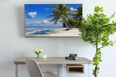 a table with a picture of a beach with palm trees at 2002 One bedroom unit for 4 Ppl next to Kaseya Center with Gym and Pool in Downtown Miami in Miami