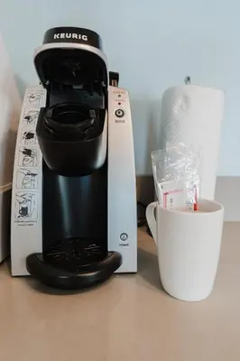 a coffee maker on a counter next to a box at Lyfe Resort & Residences By OceanMiami in Hollywood