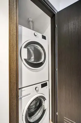 a washing machine and a dryer in a room at Lux Studio Miami and Bay views in Miami