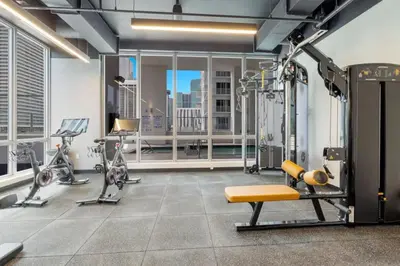a gym with cardio equipment in a building at Stunning City Views Studio Gym Pool in Miami