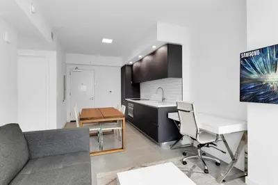 an apartment kitchen with a desk and a couch at Downtown Large Stylish 1 bedroom condo Gym pool in Miami