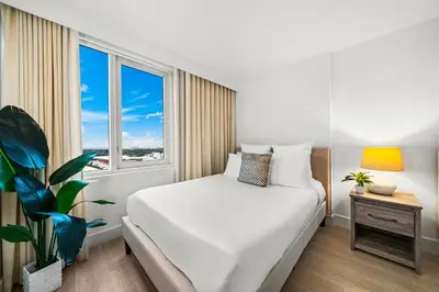 a bedroom with a white bed and a window at Studio Residence at Roney -1128 in Miami Beach