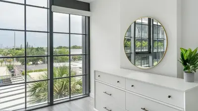 a bedroom with a white dresser and a mirror at The Juliet IV Vibe 8697 in Miami
