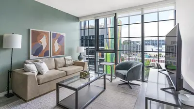 a living room with a couch and a chair at The Juliet V Vibe 8700 in Miami