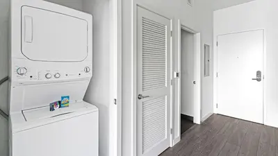 a white laundry room with a washer and dryer at The Juliet V Vibe 8700 in Miami