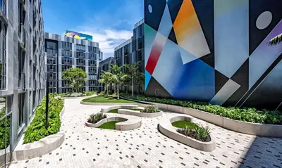 a courtyard in a city with tall buildings at The Juliet V Vibe 8700 in Miami