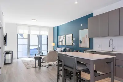 a kitchen and living room with a table and chairs at The Juliet VII Vibe 8702 in Miami