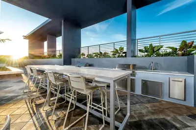 a kitchen with a large white table and chairs at The Juliet VII Vibe 8702 in Miami