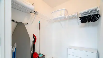 a room with a ceiling fan and a shelf at The Juliet IX Vibe 8707 in Miami