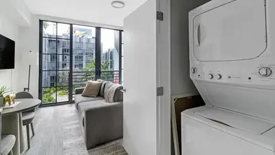a kitchen and living room with a couch and a table at The Juliet X Vibe 8741 in Miami