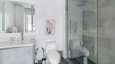 a bathroom with a toilet and a sink and a shower at The Juliet X Vibe 8741 in Miami