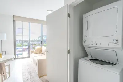 a kitchen with a washer and dryer in a room at The Juliet XII Vibe 8745 in Miami