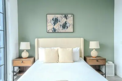 a bedroom with a white bed with two night stands at The Juliet XII Vibe 8745 in Miami