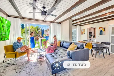 a group of people sitting in a living room at Waterfront Heated pool Lime Key Two in Fort Lauderdale
