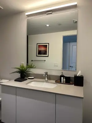 a bathroom with a sink and a large mirror at Luxury 2BR Skyline Balcony Free Parking by Palermo Home Miami in Miami