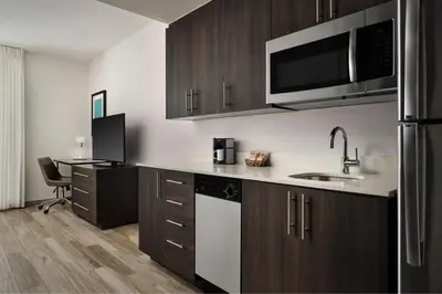 a kitchen with a sink and a microwave at Residence Inn by Marriott Miami Beach Surfside in Miami Beach