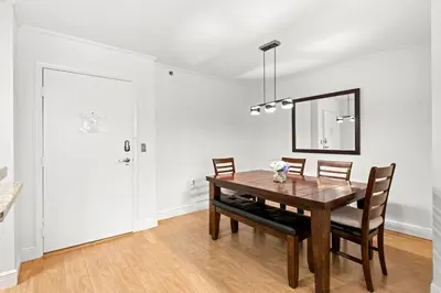 a dining room with a wooden table and chairs at Yacht Club Miami Suite 1BR and 1BA with Pool FREE Parking Gym & Jacuzzi in South Island