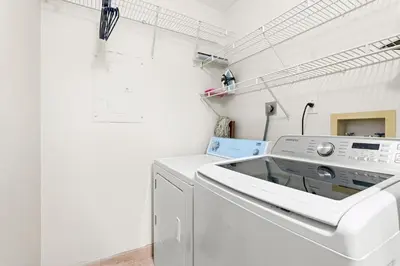 a white washer and dryer in a laundry room at Yacht Club Miami Suite 1BR and 1BA with Pool FREE Parking Gym & Jacuzzi in South Island