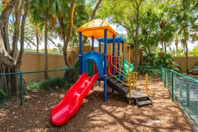 a playground with a slide in a park at Yacht Club Miami Suite 1BR and 1BA with Pool FREE Parking Gym & Jacuzzi in South Island