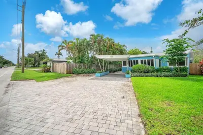 a house on the side of the road at The Frolics -Stunning Wilton Manors Pool Home in Fort Lauderdale