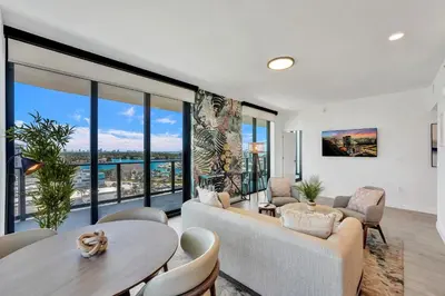 a living room with a couch and a table at 72 Park by Nomada Residences in Miami Beach
