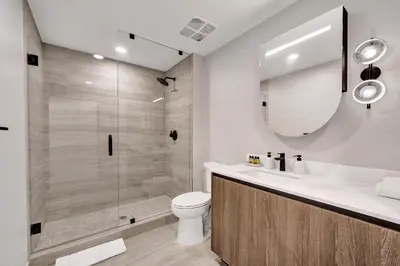 a bathroom with a shower and a toilet and a sink at 72 Park by Nomada Residences in Miami Beach