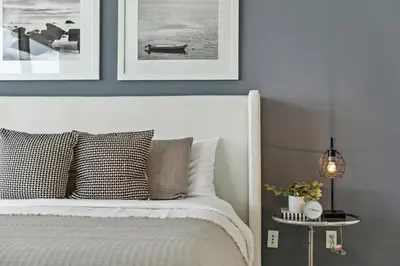 a bedroom with a white bed with pictures on the wall at Apartment on the Highest Floor - Icon Brickell 3 in Miami