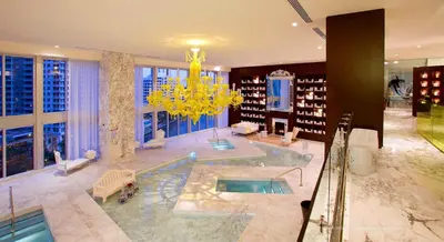 a large bathroom with a tub with a chandelier at Apartment on the Highest Floor - Icon Brickell 3 in Miami