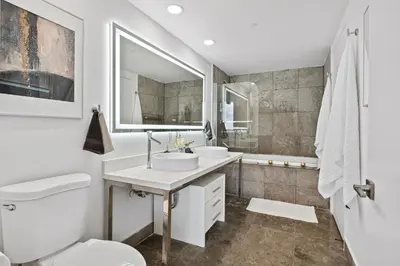 a bathroom with a toilet and a sink at Apartment on the Highest Floor - Icon Brickell 3 in Miami