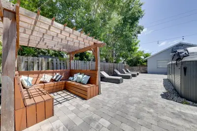 a patio with couches and a wooden pergola at Unique 2 House Rental 3 Mi to Beach and Boardwalk in Hollywood