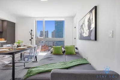 a living room with a couch and a table at Beautiful 2BR Apartment with gym and Pool in Miami