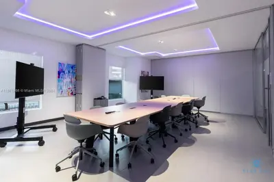 a large conference room with a long table and chairs at Beautiful 2BR Apartment with gym and Pool in Miami