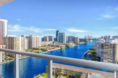 a view of a river in a city with buildings at Stylish -2BR Apartment -Balcony & Pool in Hallandale Beach