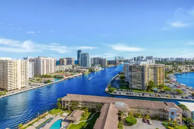 a view of a river in a city with buildings at Amazing 1BR Apt View & Balcony - Pool & Gym in Hallandale Beach