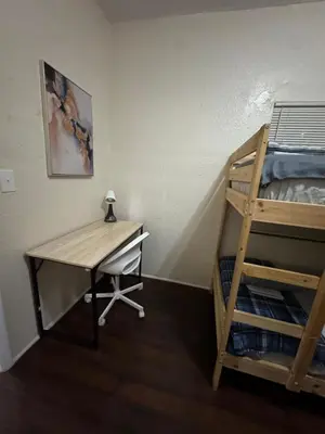 a bedroom with a desk and a bunk bed at Belle Vista in Miami