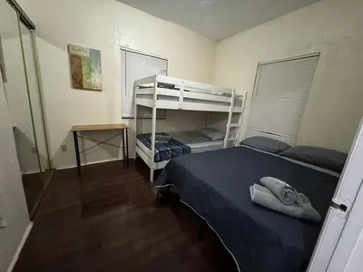a bedroom with a bed and a bunk bed at Belle Vista in Miami
