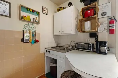 a small kitchen with a sink and a counter at 1BR Pet-Friendly Studio Parking & Backyard BBQ in Hollywood