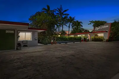an empty parking lot in front of a building at Hollywood 1BR Studio: Pets Allowed, BBQ & Parking in Hollywood