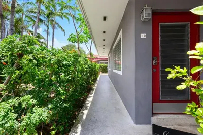 a hallway of a house with a red door at Modern 1BR Studio in Hollywood | Free Parking in Hollywood