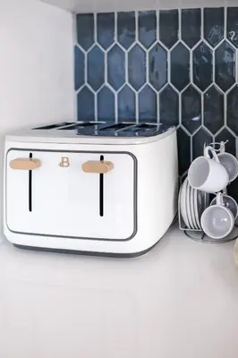 a white toaster sitting on a counter in a kitchen at Miami Freedom Park Oasis by H&S in Miami