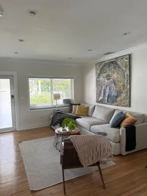 a living room with a couch and a table at Charming two Bedroom in the Gables For Rent in Miami