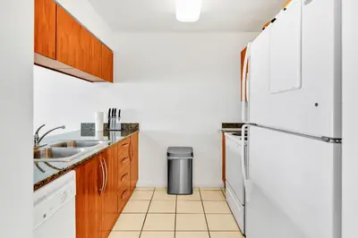 a kitchen with a white refrigerator and a sink at Luxury3 Miami Brickell Stay-Bay View in Miami